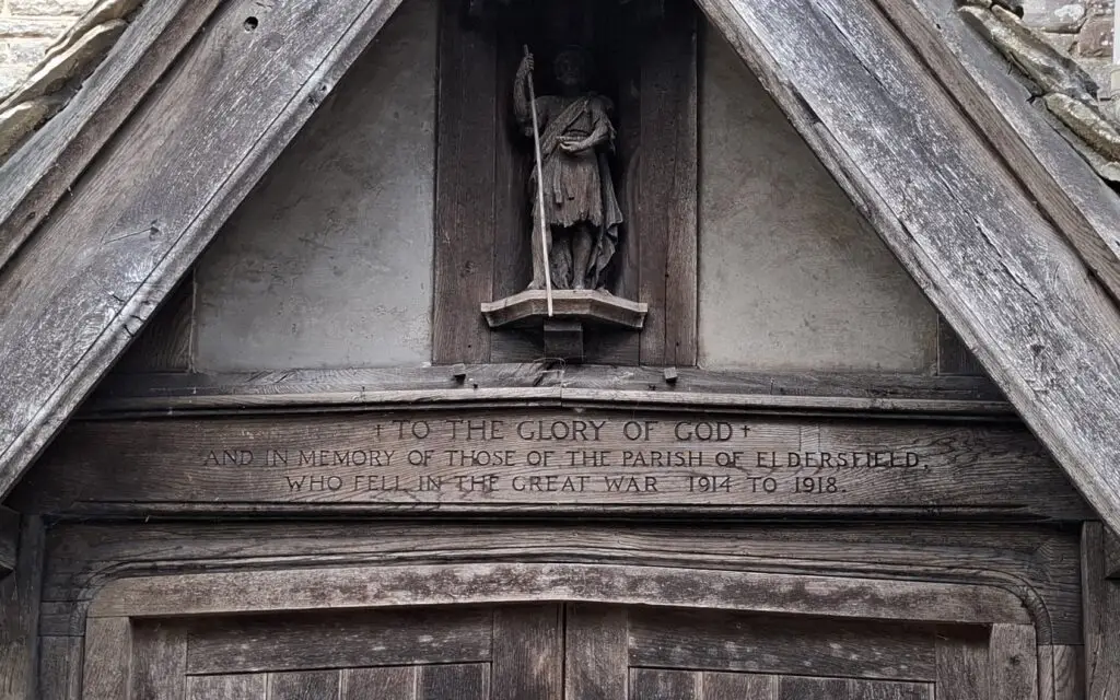 Photograph of inscritpion to the War Dead on lintel of the door to Church porch